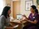Pelvic Floor कमजोर या Tight? - Physiotherapist explaining pelvic floor muscle function to a female patient.