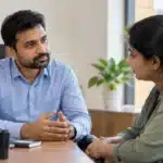Manager having a supportive conversation with an employee about workplace mental health