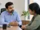 Manager having a supportive conversation with an employee about workplace mental health