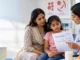 Doctor explaining low vitamin D levels and bone health to a child and parent.